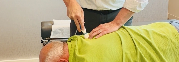 Chiropractor Performing Spinal Adjustment On Patient